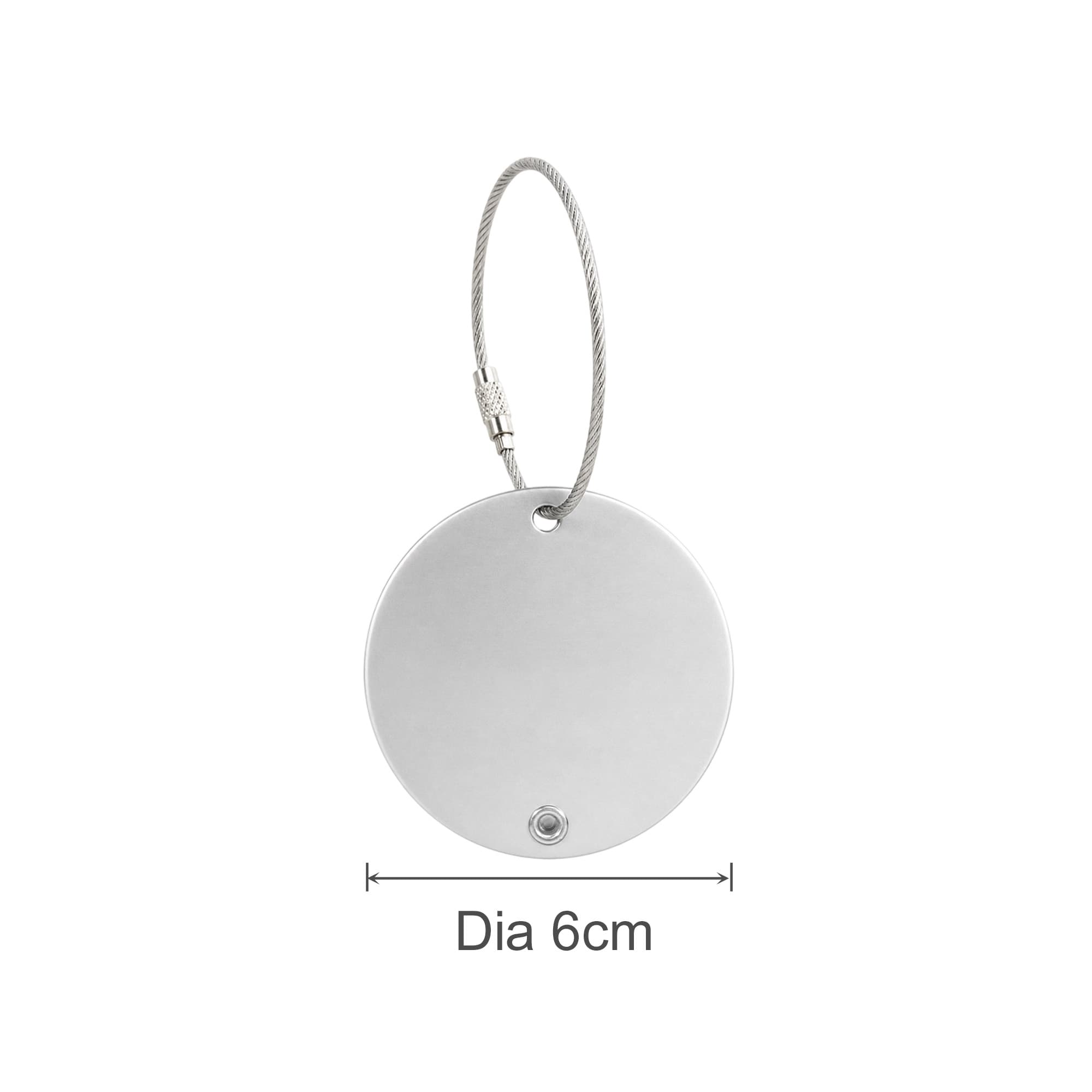 A round silver wire cable luggage tag, measuring 6cm in diameter, with a loop for attachment.
