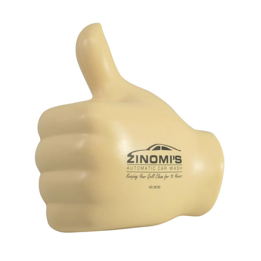 A yellow fist-shaped stress reliever with a thumbs-up design and a logo displayed on it.