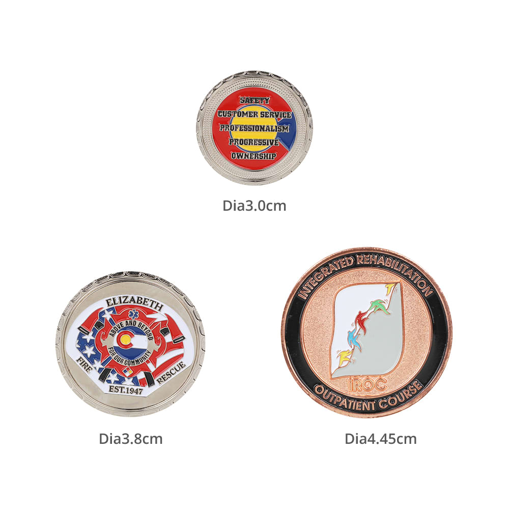 Commemorative gold coin pins in various designs, including red, blue, and gold colours, featuring a logo and inscriptions.