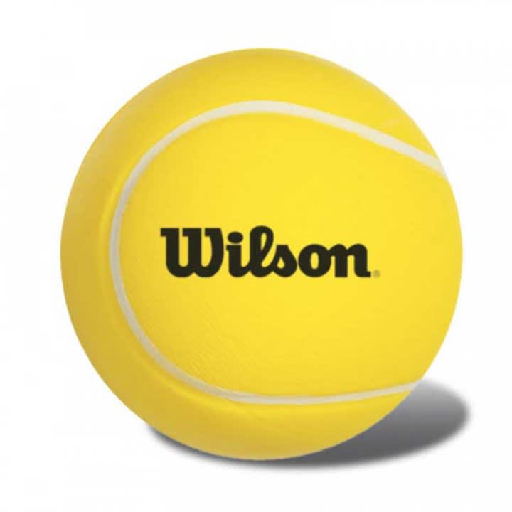 A yellow stress reliever shaped like a tennis ball with a logo. It has white detailing and a smooth texture.