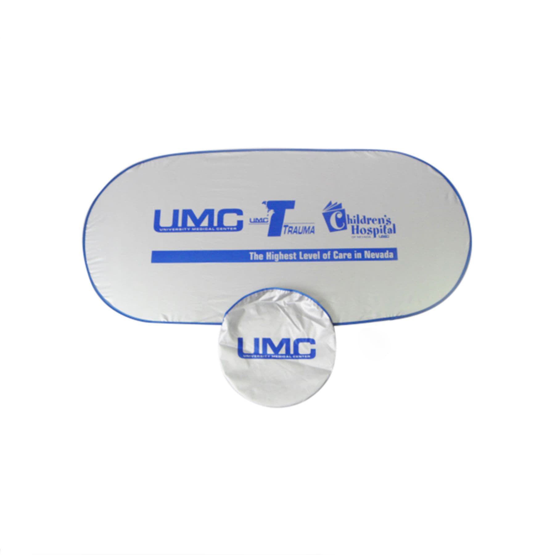 A silver car shade with a blue trim, featuring a logo and a circular storage bag.