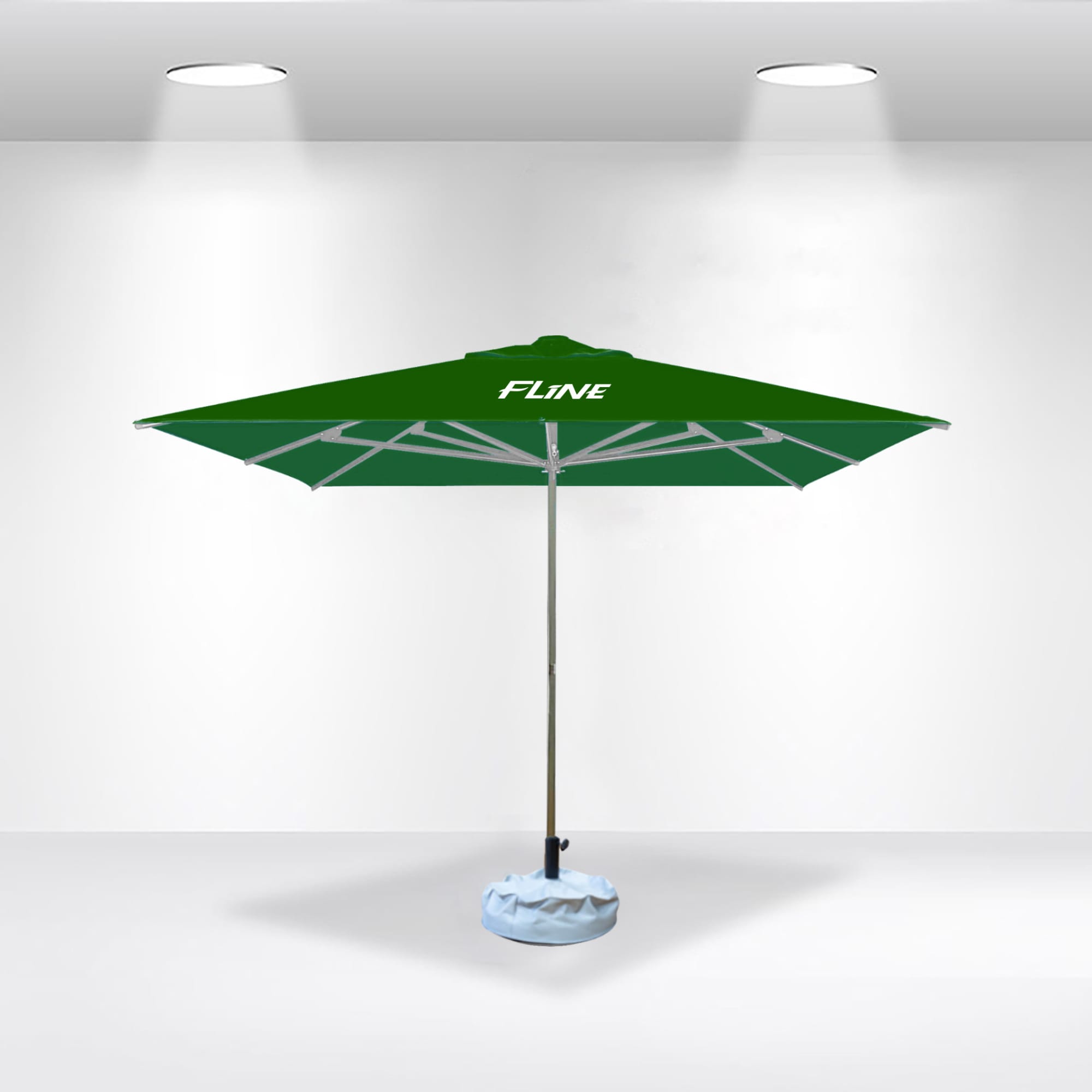 A green commercial market umbrella with a silver pole, featuring a branded logo, set against a plain background.