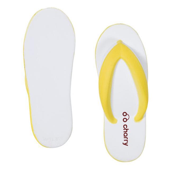 A yellow and white flip-flop shaped stress reliever with a smooth surface and a logo on it.