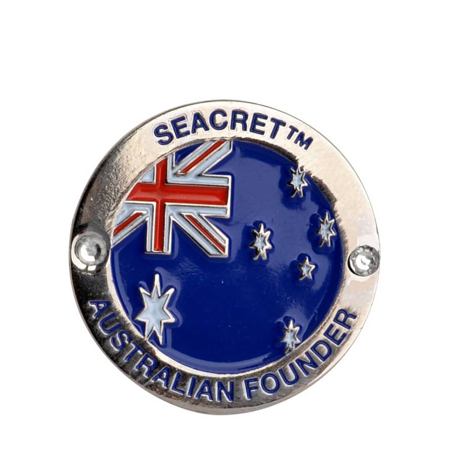 A circular embossed soft enamel pin featuring a blue background with the Australian flag and stars, bordered in silver.
