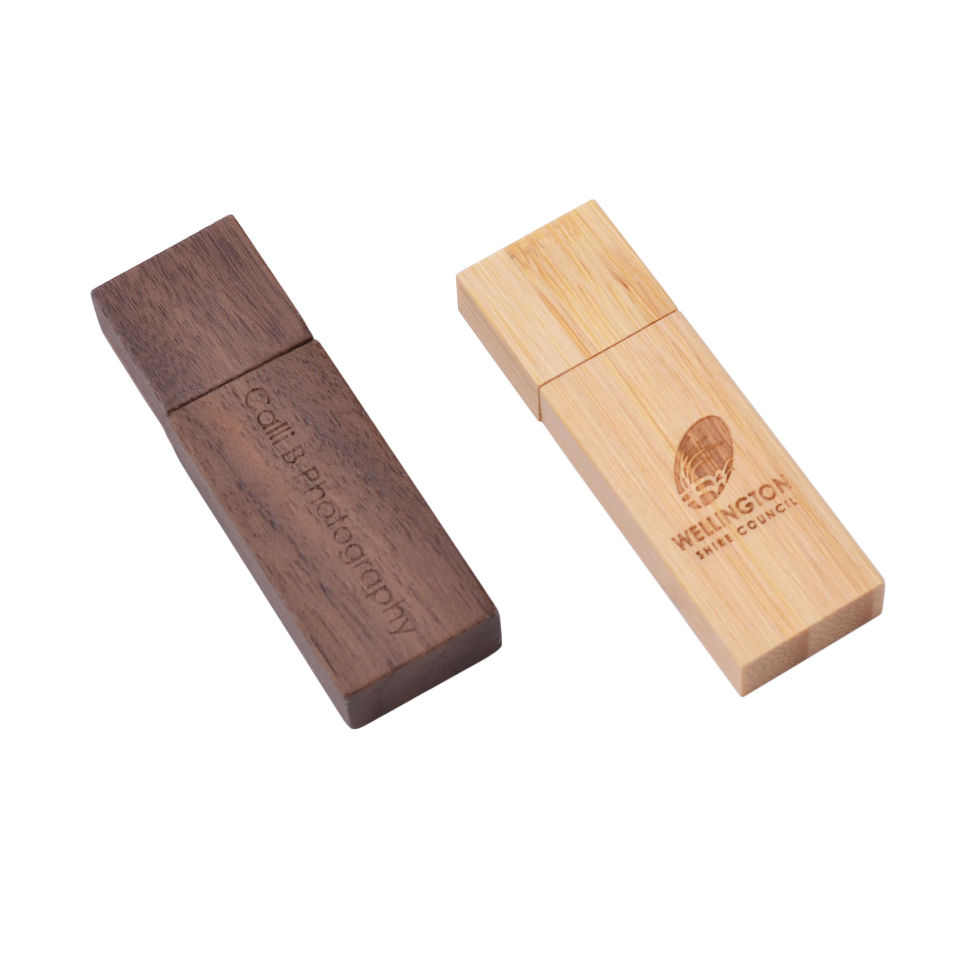 A rectangular wooden flash drive featuring a dark wood finish and a light bamboo finish, both with branding.