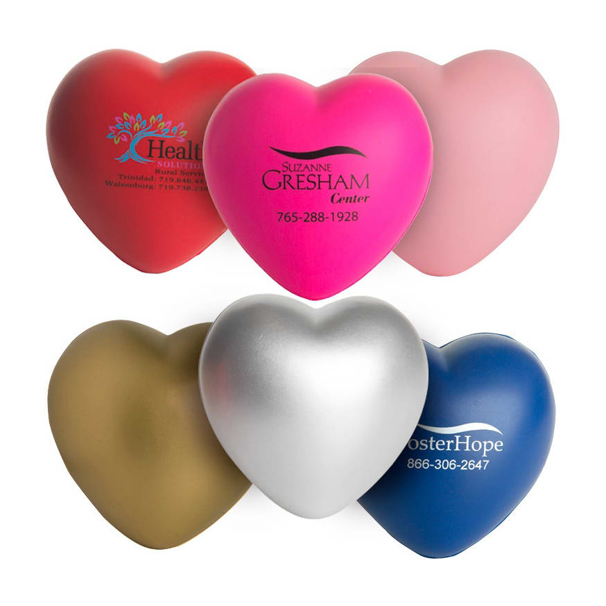 A range of heart-shaped stress relievers in red, pink, silver, gold, and blue, featuring various logos.