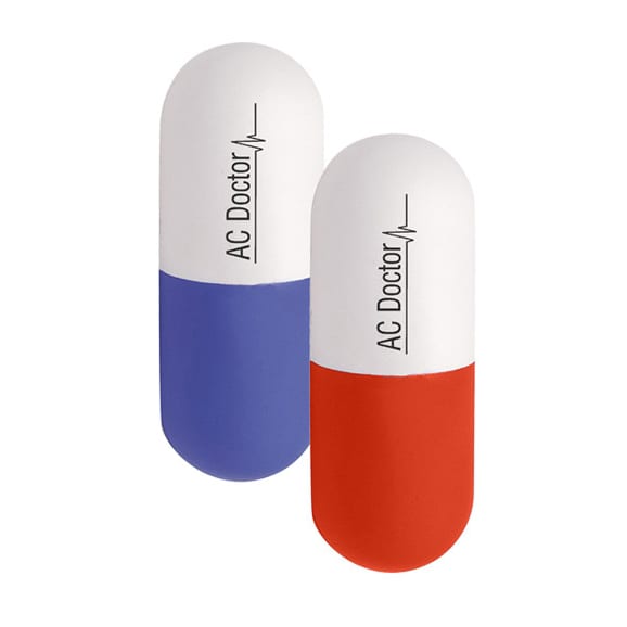 Capsule-shaped stress relievers in red and blue, featuring a logo on the surface.