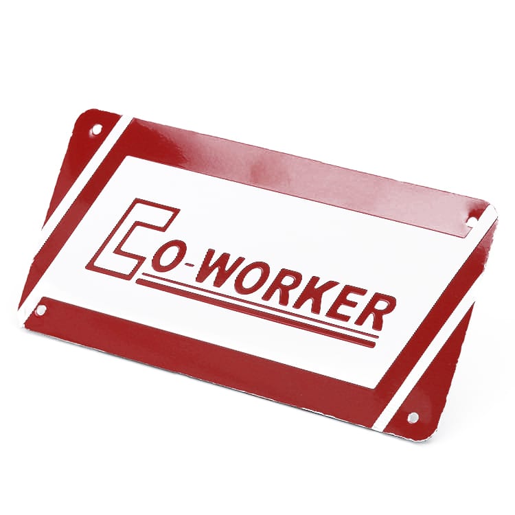 A red and white metal licence plate featuring the word "CO-WORKER" and has a logo.
