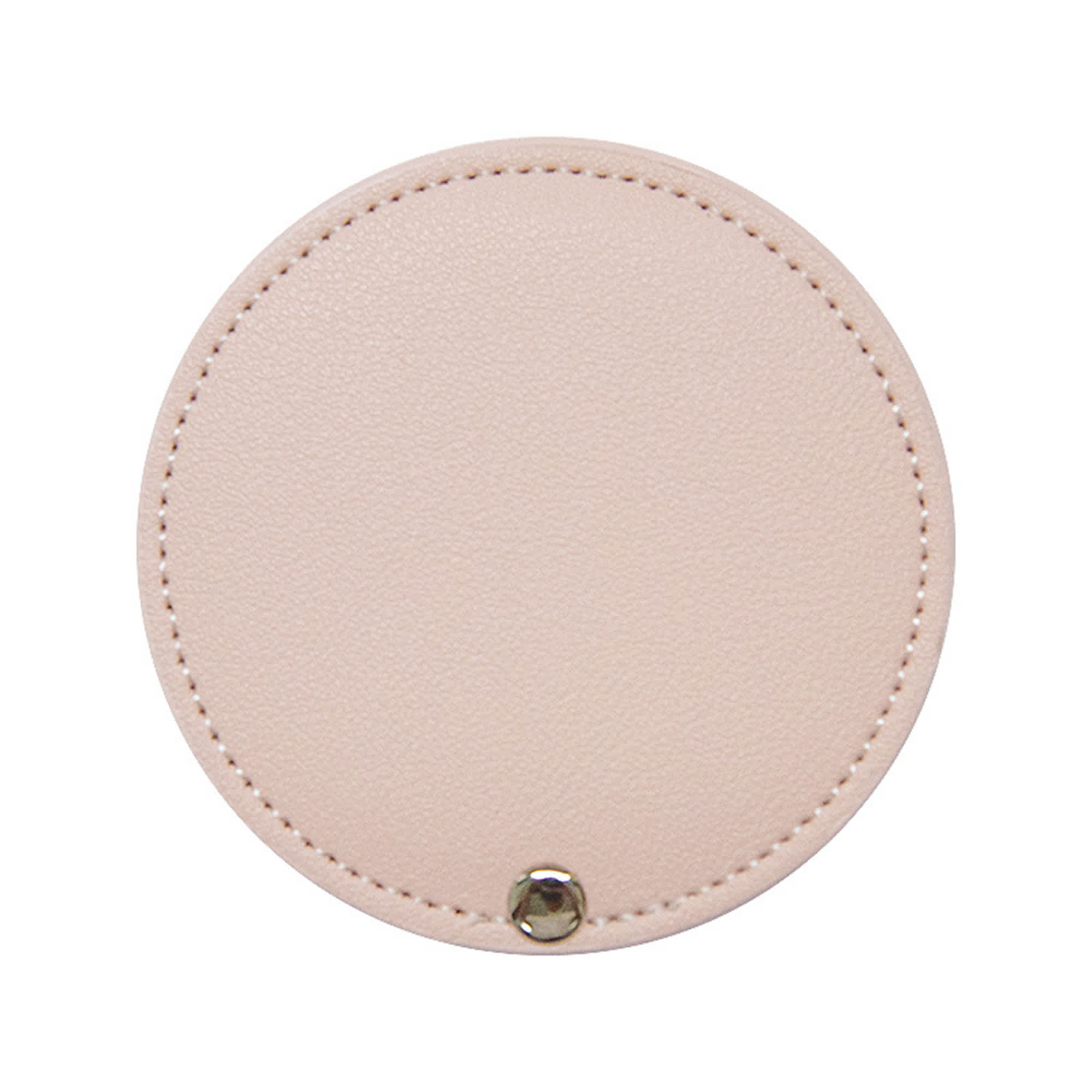 A round makeup mirror in a soft pink colour with a stitched edge and a metal button detail.