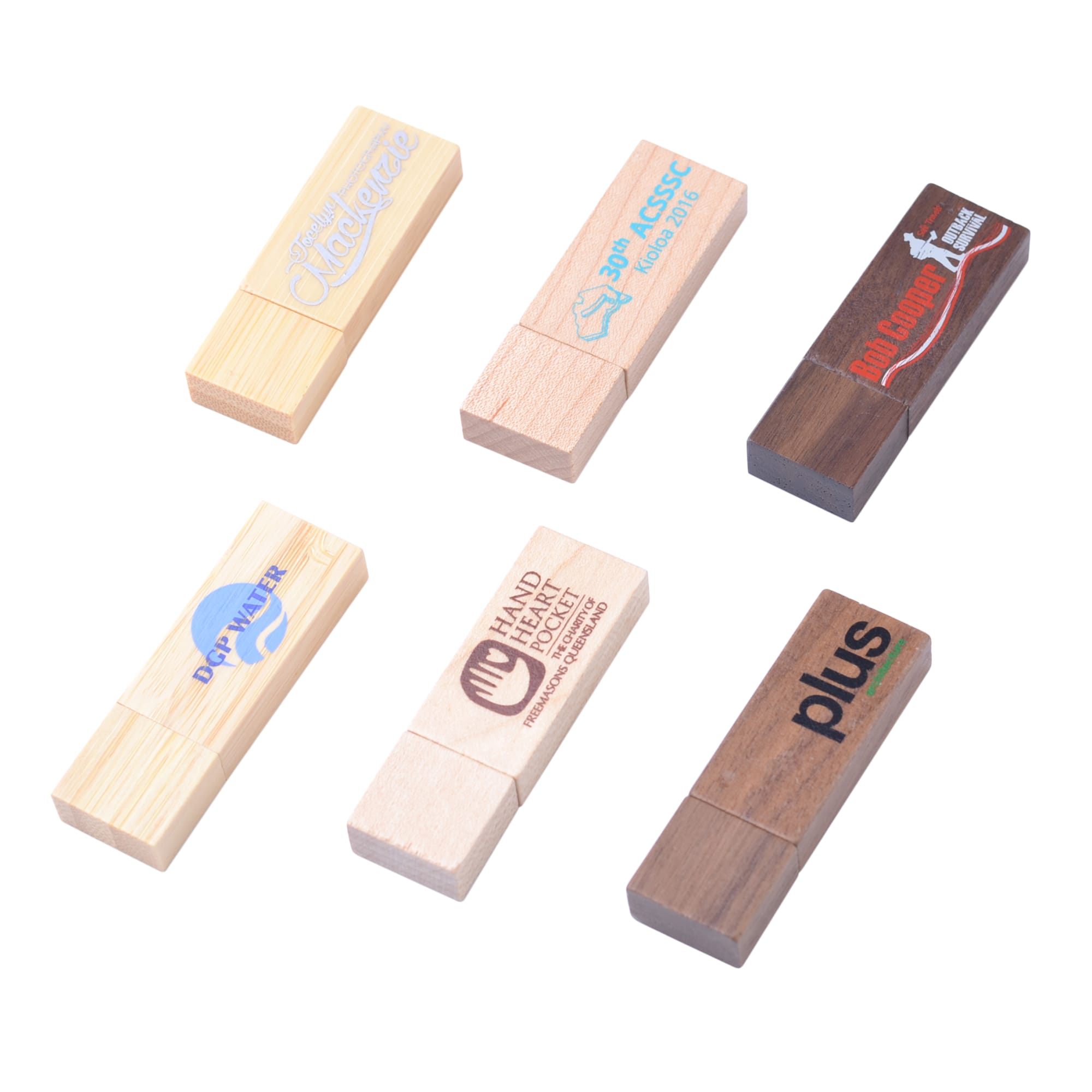 A collection of wooden flash drives in various finishes, featuring logos and promotional designs.