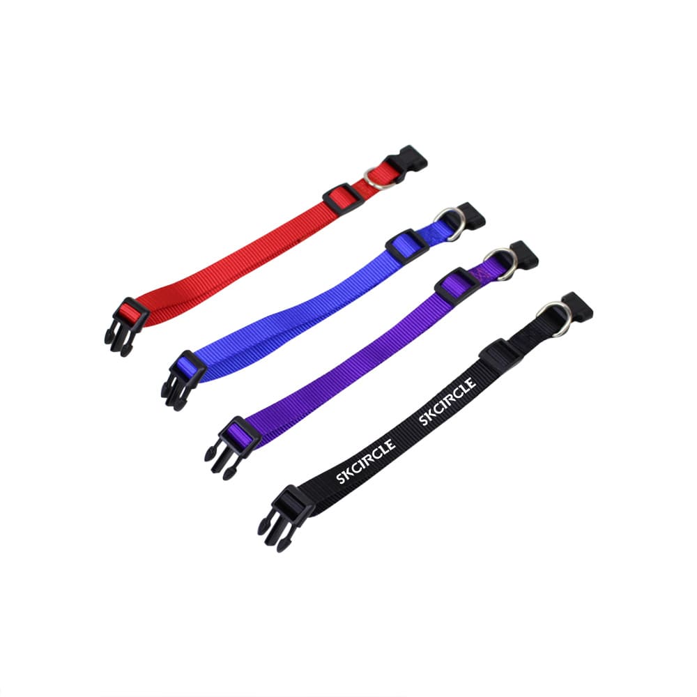 A collection of dog collars in red, blue, purple, and black, featuring adjustable clips and rings.