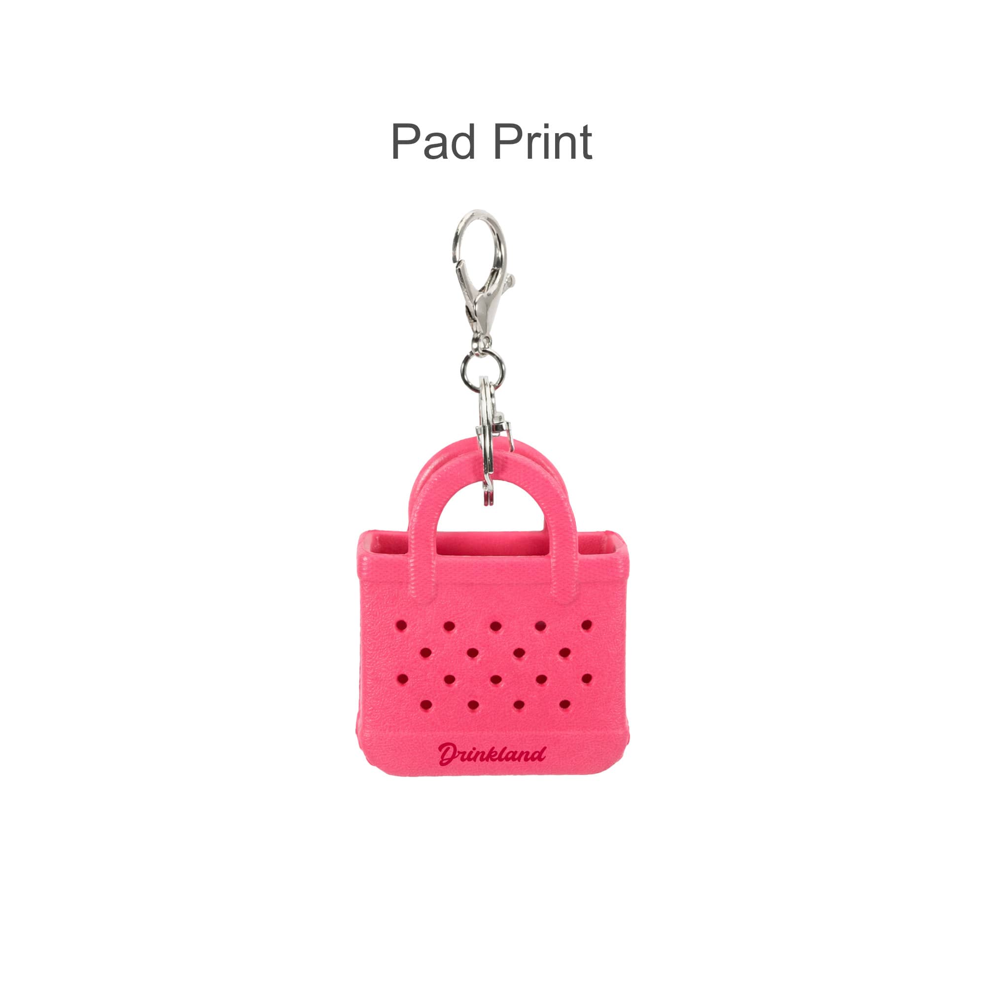 A pink mini EVA holes bag keychain with a silver clip, featuring a simple handbag design and branding.