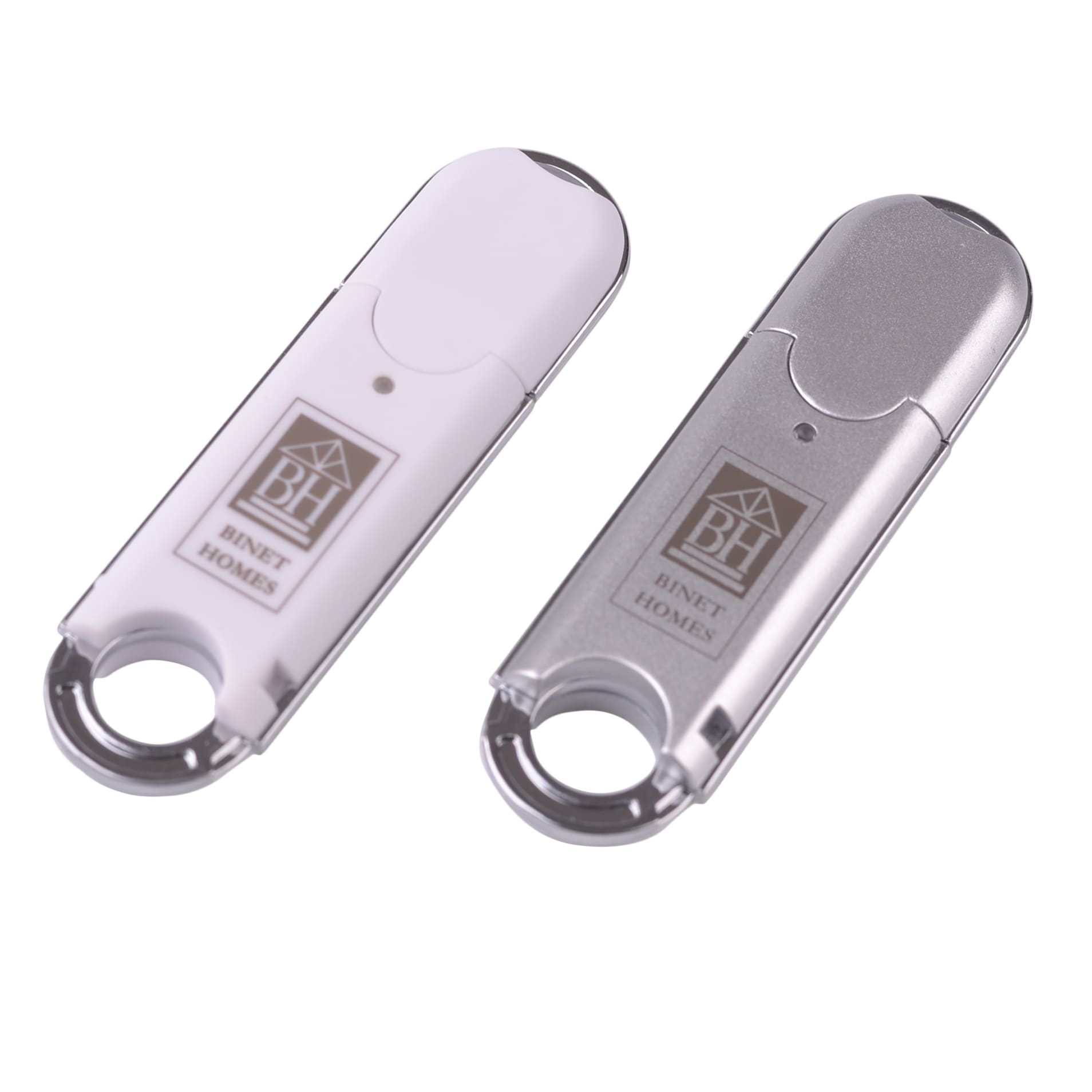 A silver and white O-ring flash drive, each with a keyring attachment and a logo.