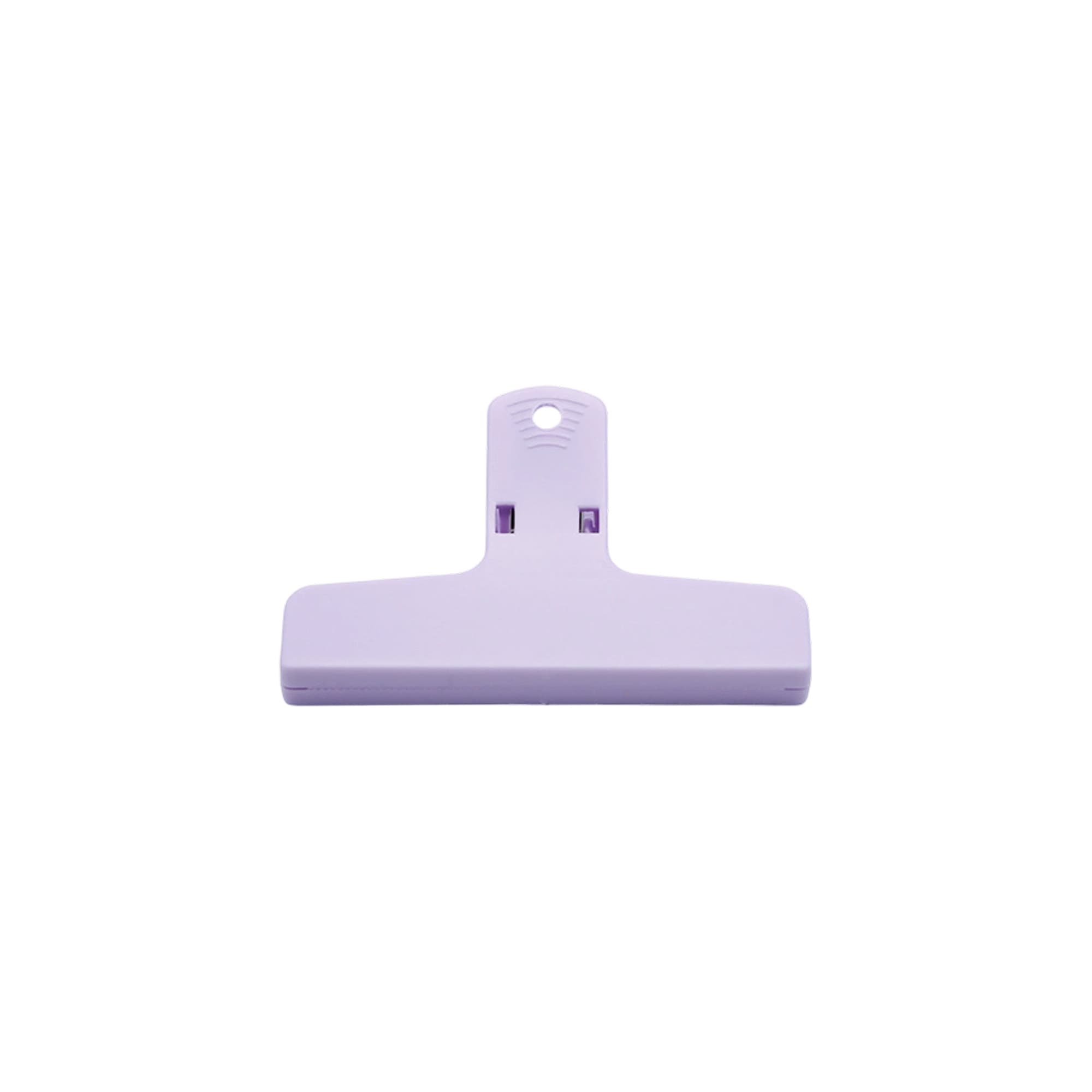 A purple plastic magnetic clip with a flat base and a loop for hanging. It features a logo on the surface.