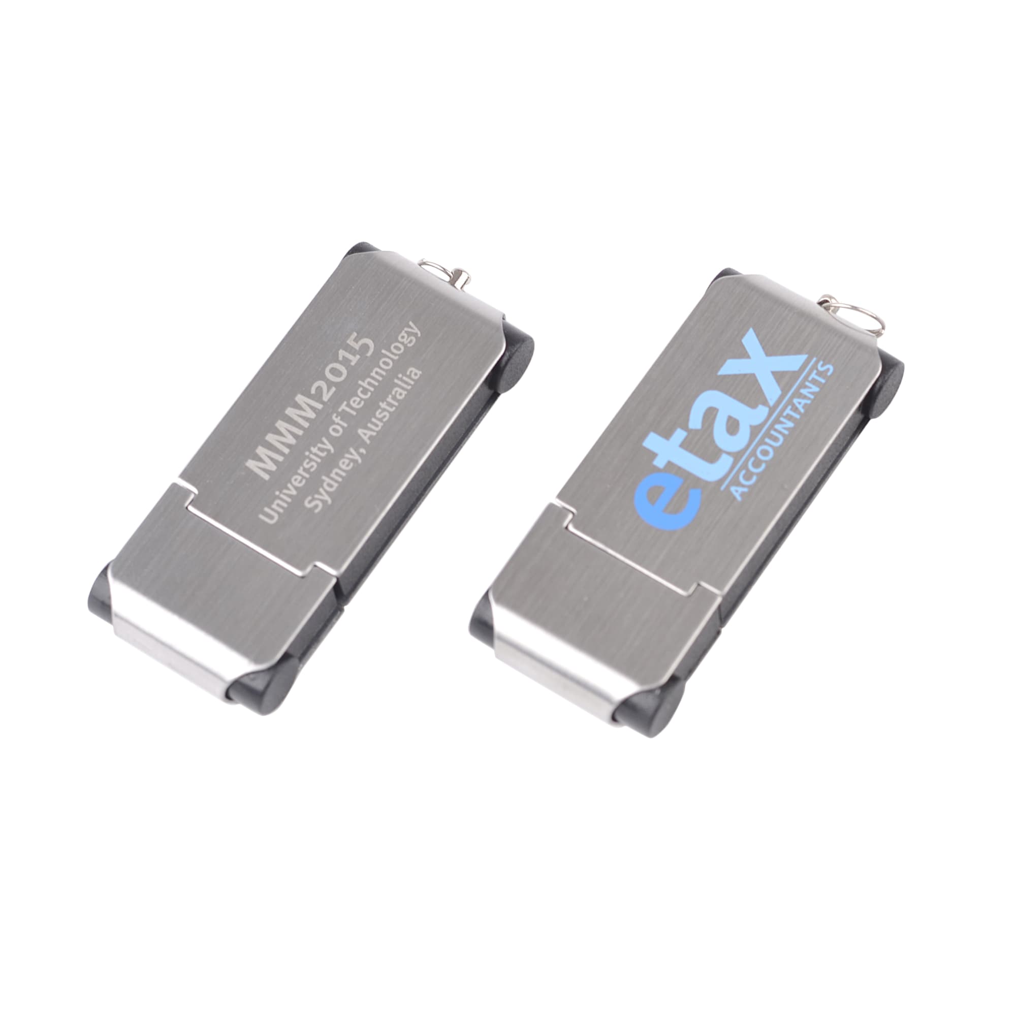 A silver and black flash drive featuring a logo and engraved text, showcasing a sleek and modern design.