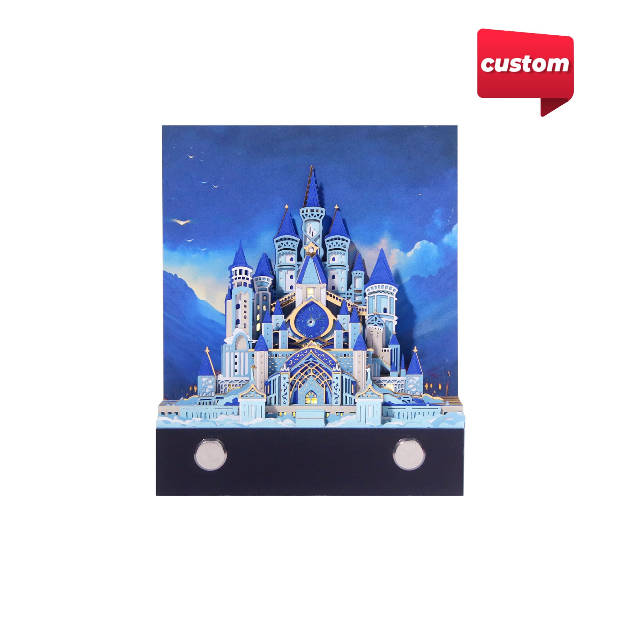 A 3D paper-cut sculpture notepad featuring a blue and white castle design with a hanging loop. Includes a logo.