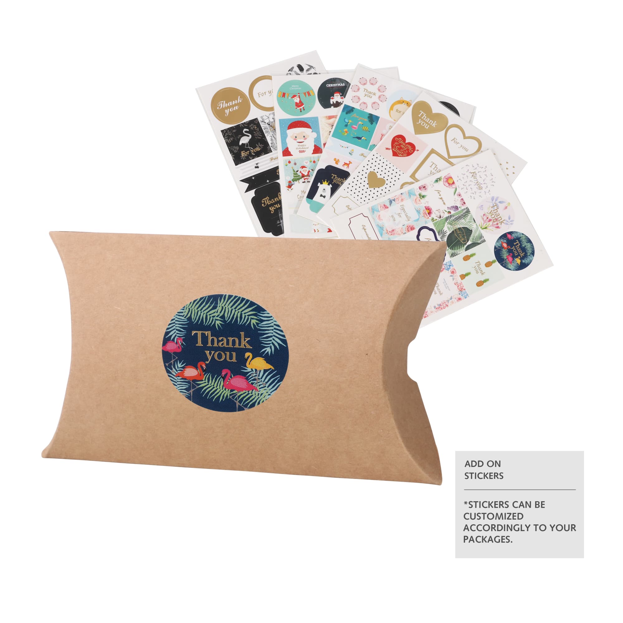 A small brown kraft pillow box with a circular sticker design and a selection of decorative stickers in the background.