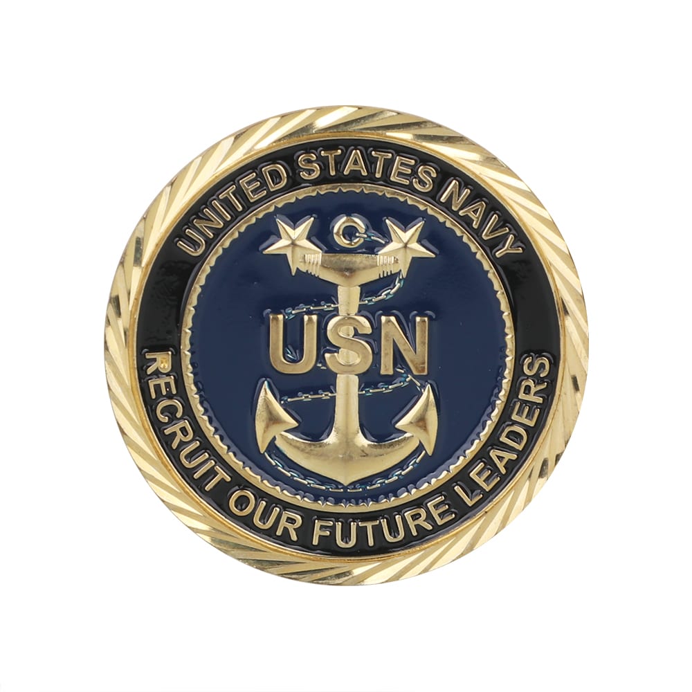 A gold and navy enamel commemorative coin pin featuring an anchor design and the text "United States Navy."