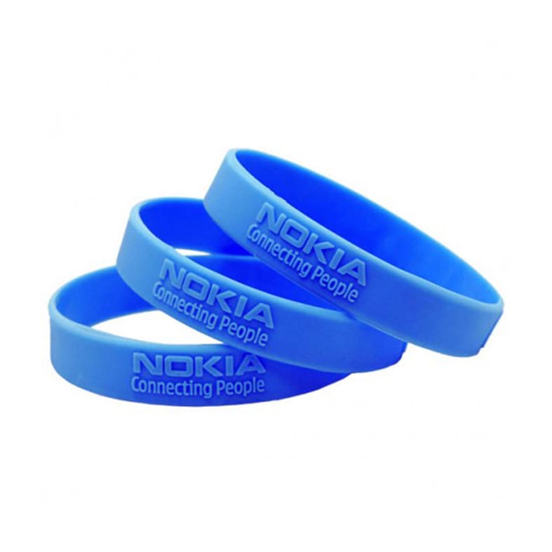 A set of three blue silicone wristbands featuring a logo and embossed text.