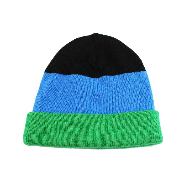 A knitted beanie featuring black, blue, and green horizontal stripes, with a logo on the side.