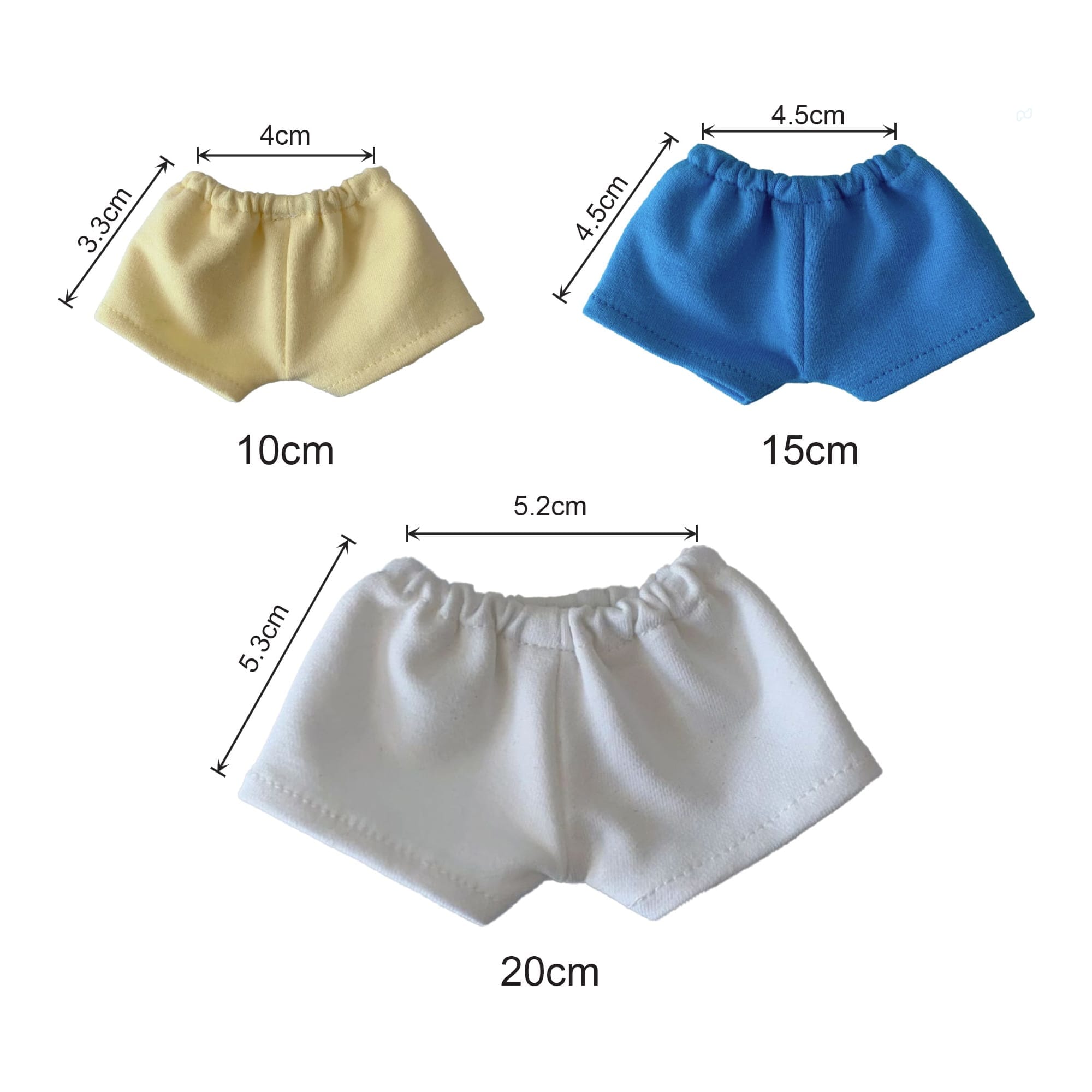 Three pairs of plush doll shorts in yellow, blue, and white, with measurements displayed beside each pair.