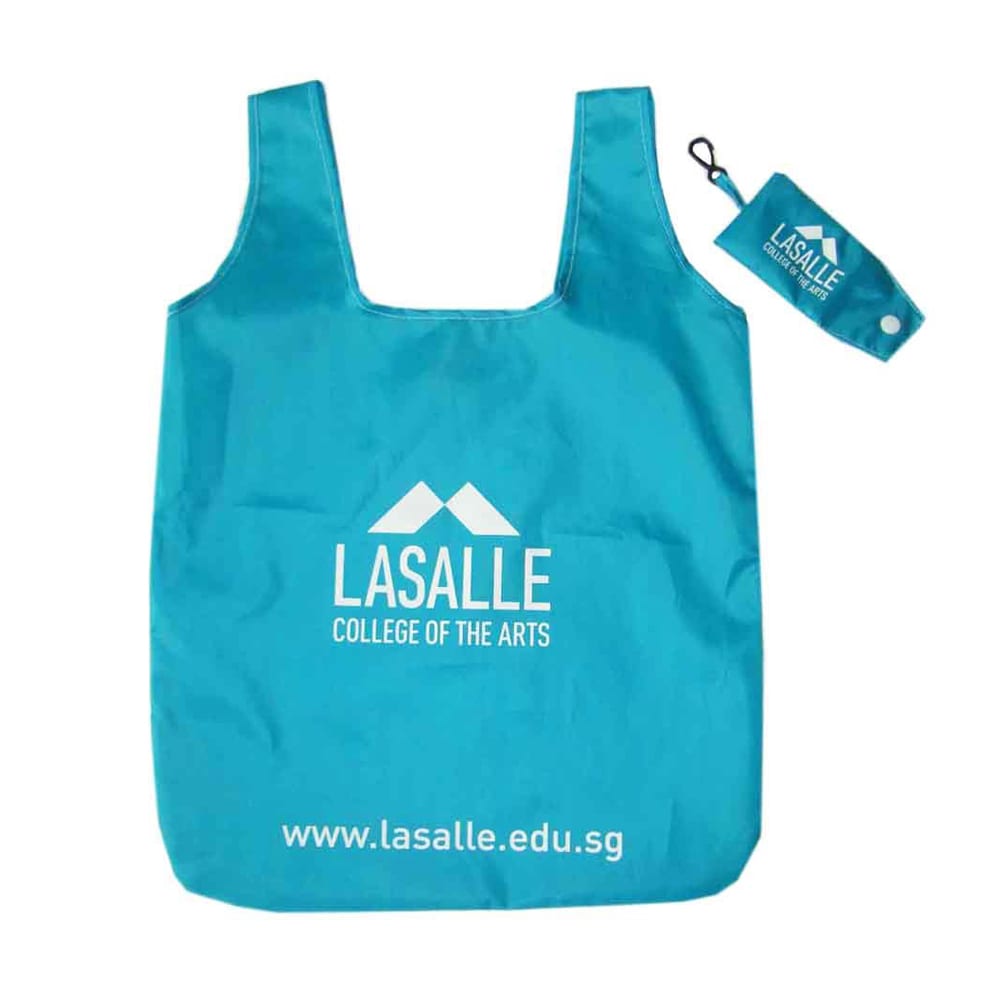 A turquoise foldable shopping tote bag with a logo and a small carrying pouch.