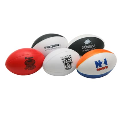 A collection of stress balls shaped like Australian footballs in various colours, including red, white, and black. Each has a logo.