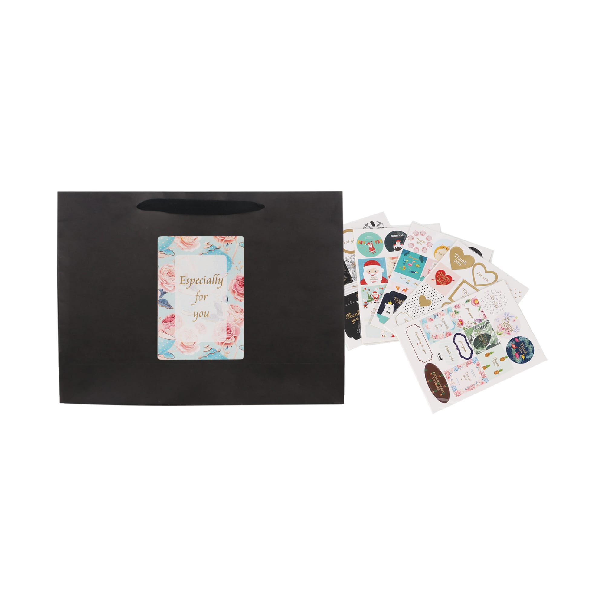 A medium black paper bag with a fabric flat handle, accompanied by a collection of decorative stickers.