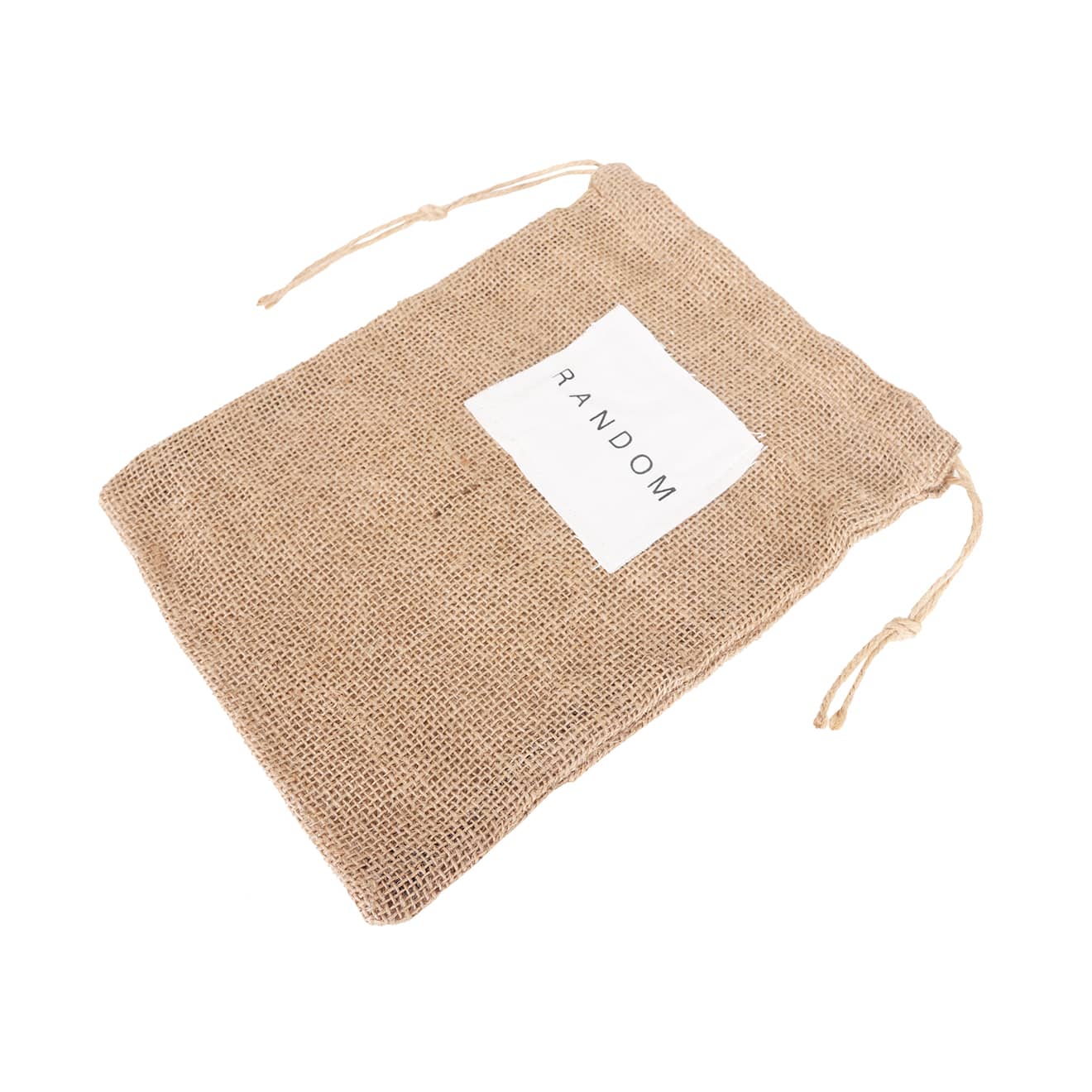 A jute net produce bag in natural brown with a white label and drawstring closure.