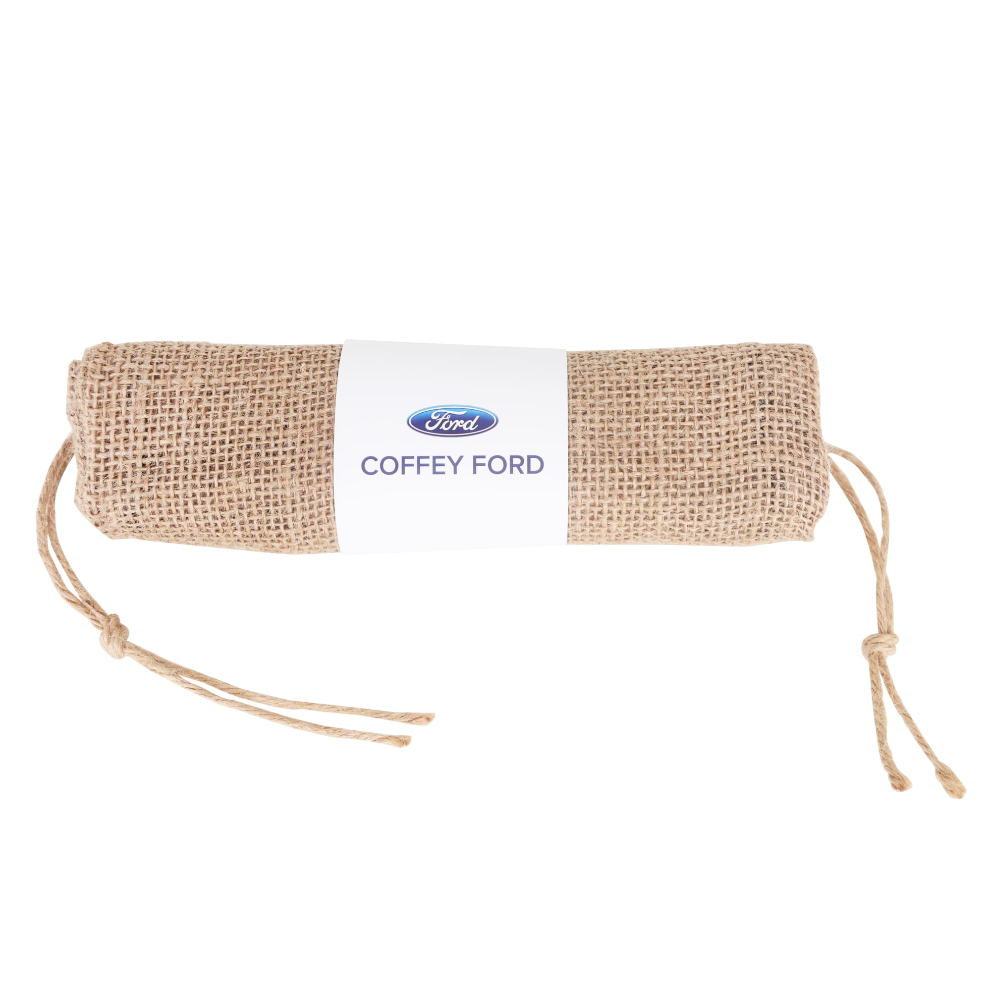 A jute net produce bag, rolled and tied with twine, featuring a logo on a white label.