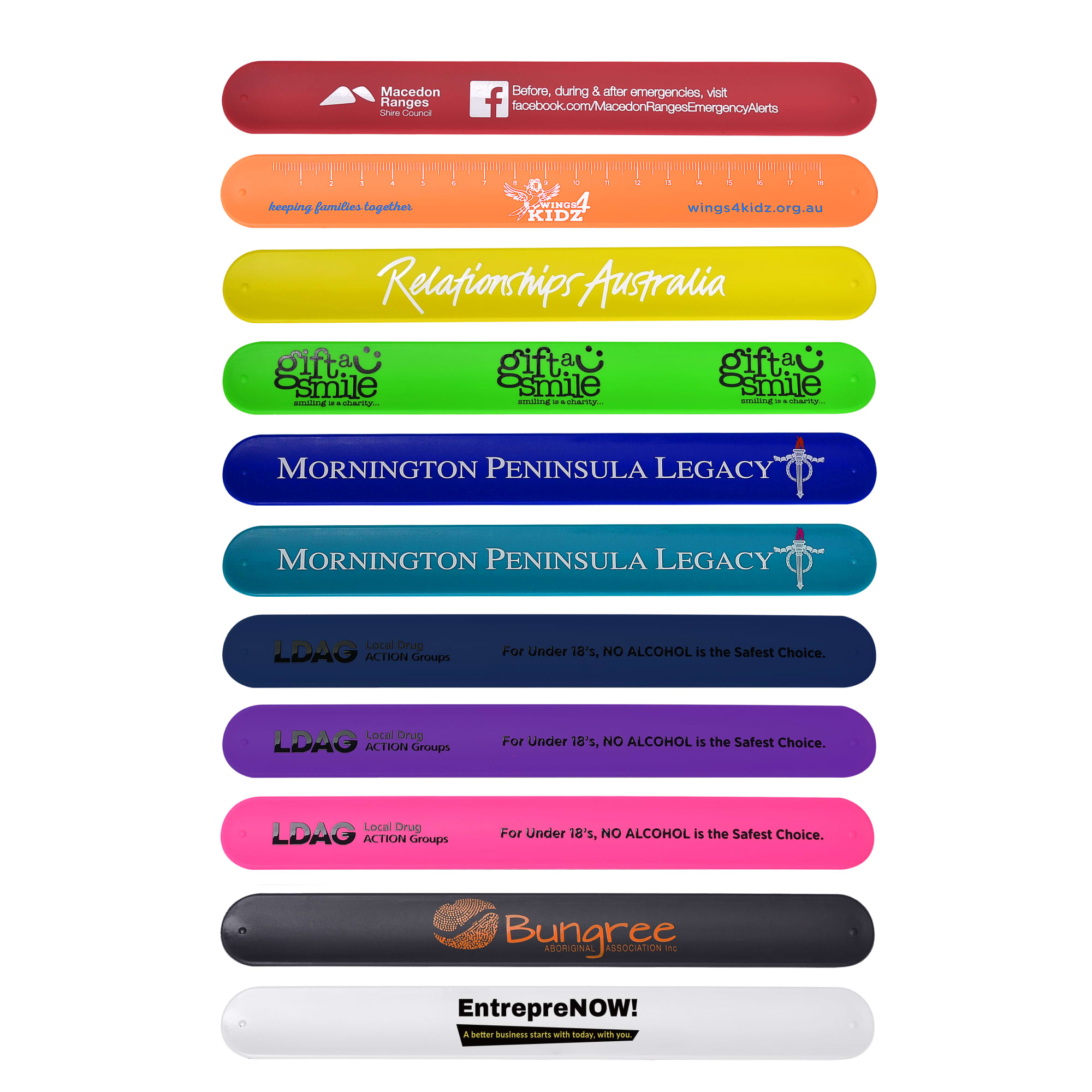 A collection of silicone slap bands in various colours, featuring logos and text from different organisations.