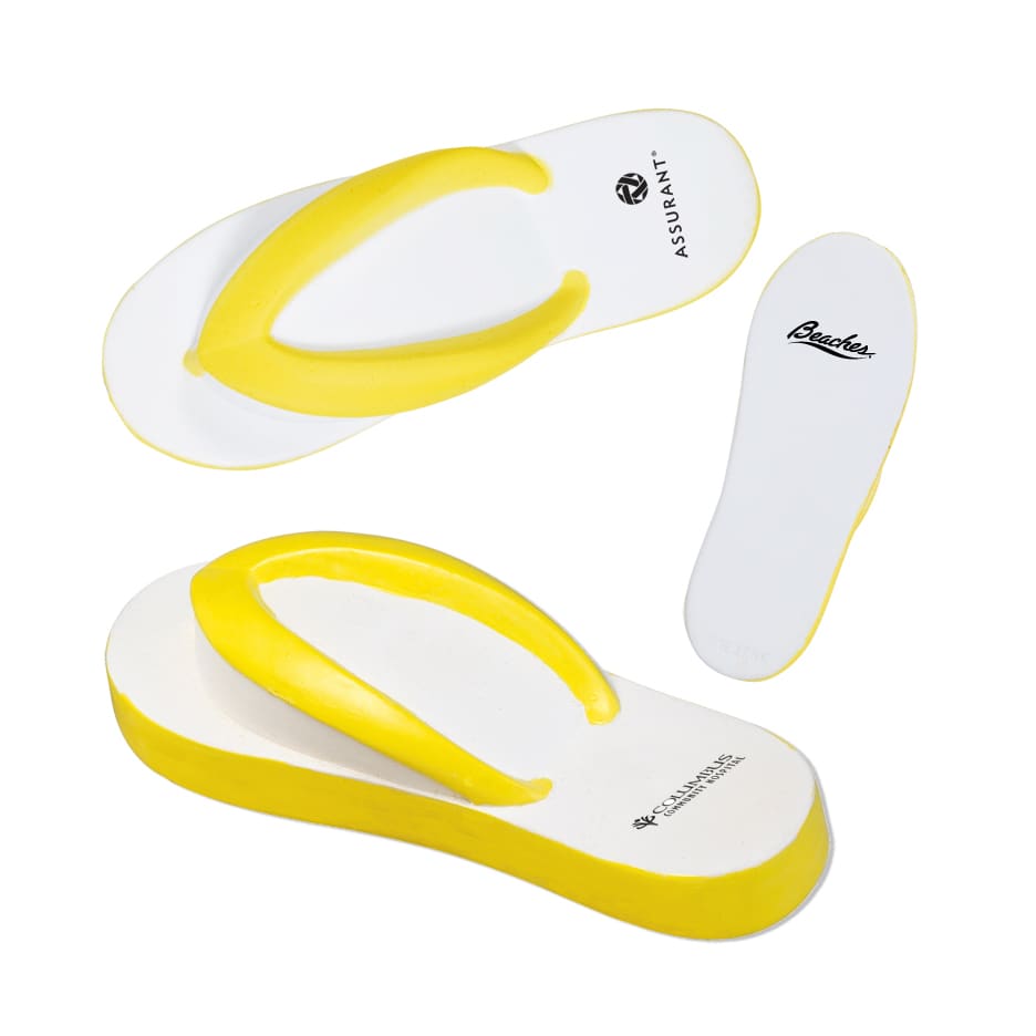 A yellow and white stress reliever shaped like a pair of flip-flops, featuring a logo on one side.