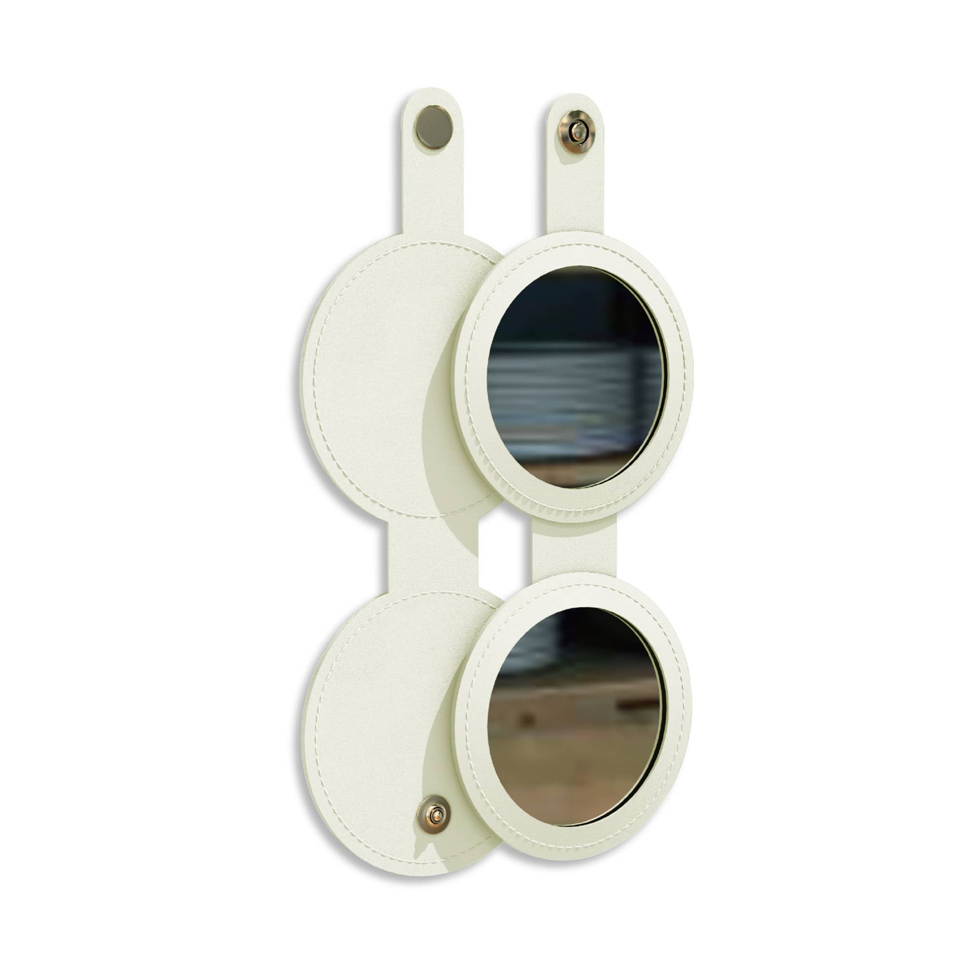 A round folding pocket mirror in cream, featuring two circular mirrors with a leather-like finish and a button closure.