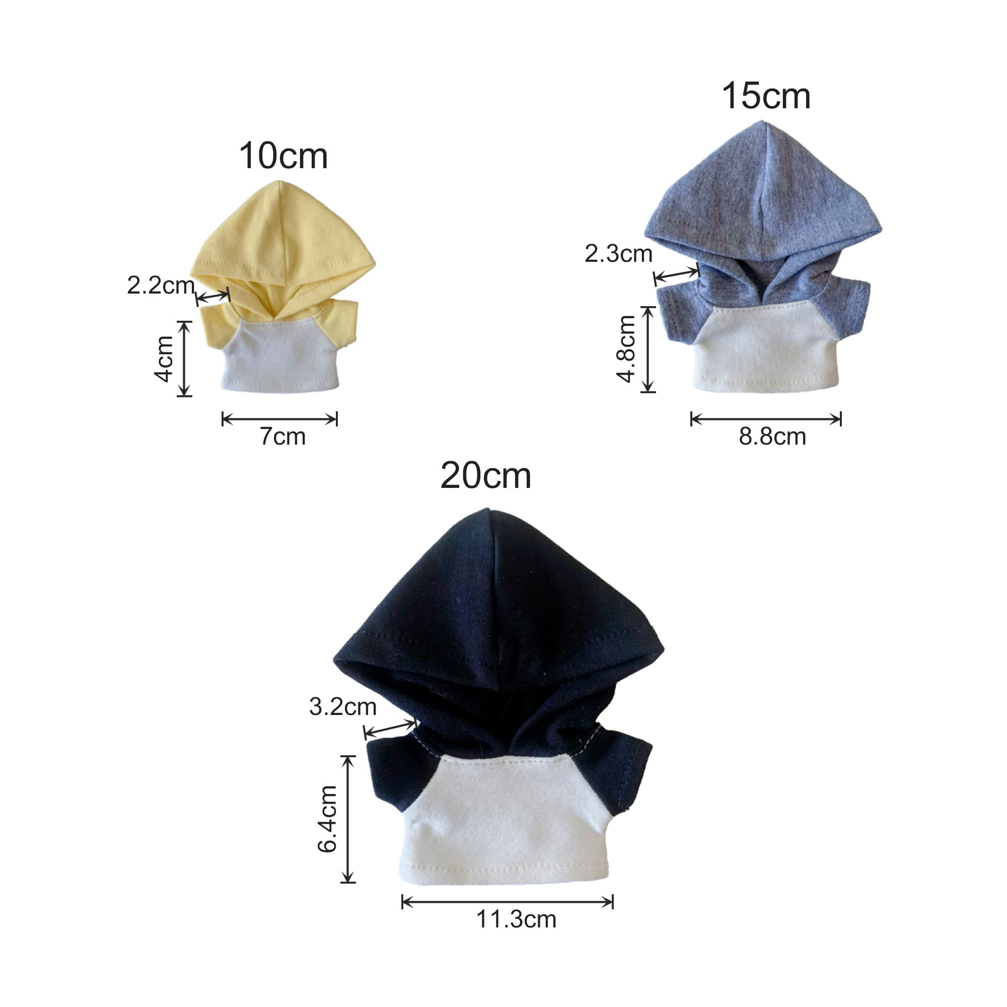 Three plush doll hoodies in yellow, grey, and navy, featuring a contrasting base colour and different sizes.