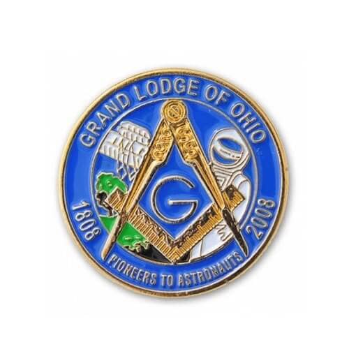 A blue and gold enamel pin featuring Masonic symbols, an astronaut, and representation of Ohio.