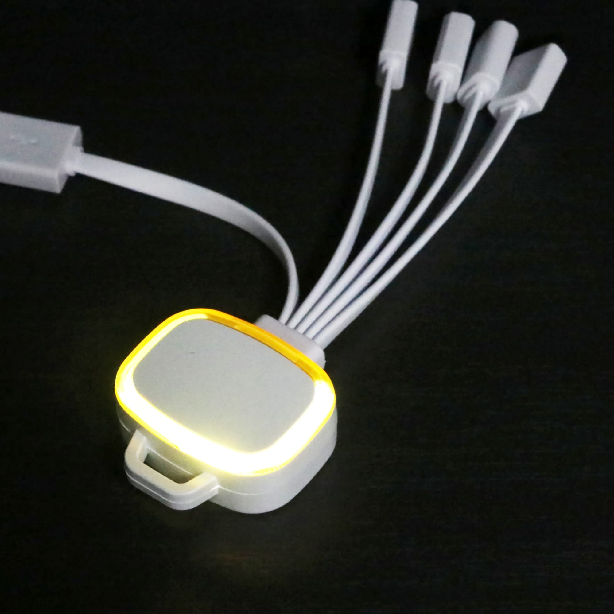 A LED charging cable with multiple connectors in white, featuring an illuminated section for visibility.