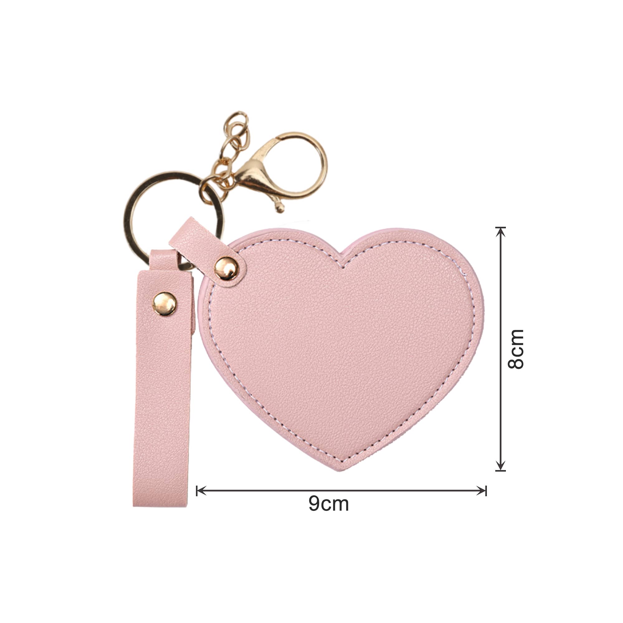 A heart-shaped compact mirror in pink, attached to a keychain with a lobster clasp and a strap.