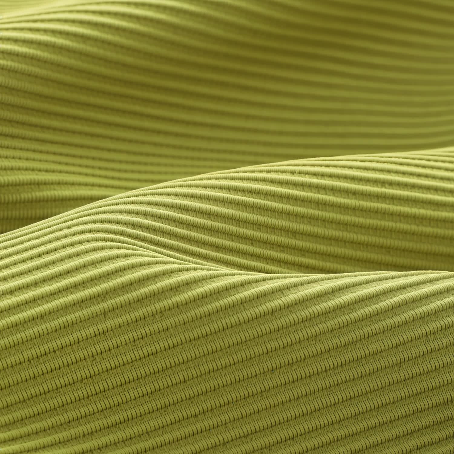 A textured, close-up view of ribbed fabric in a vibrant lime green colour.