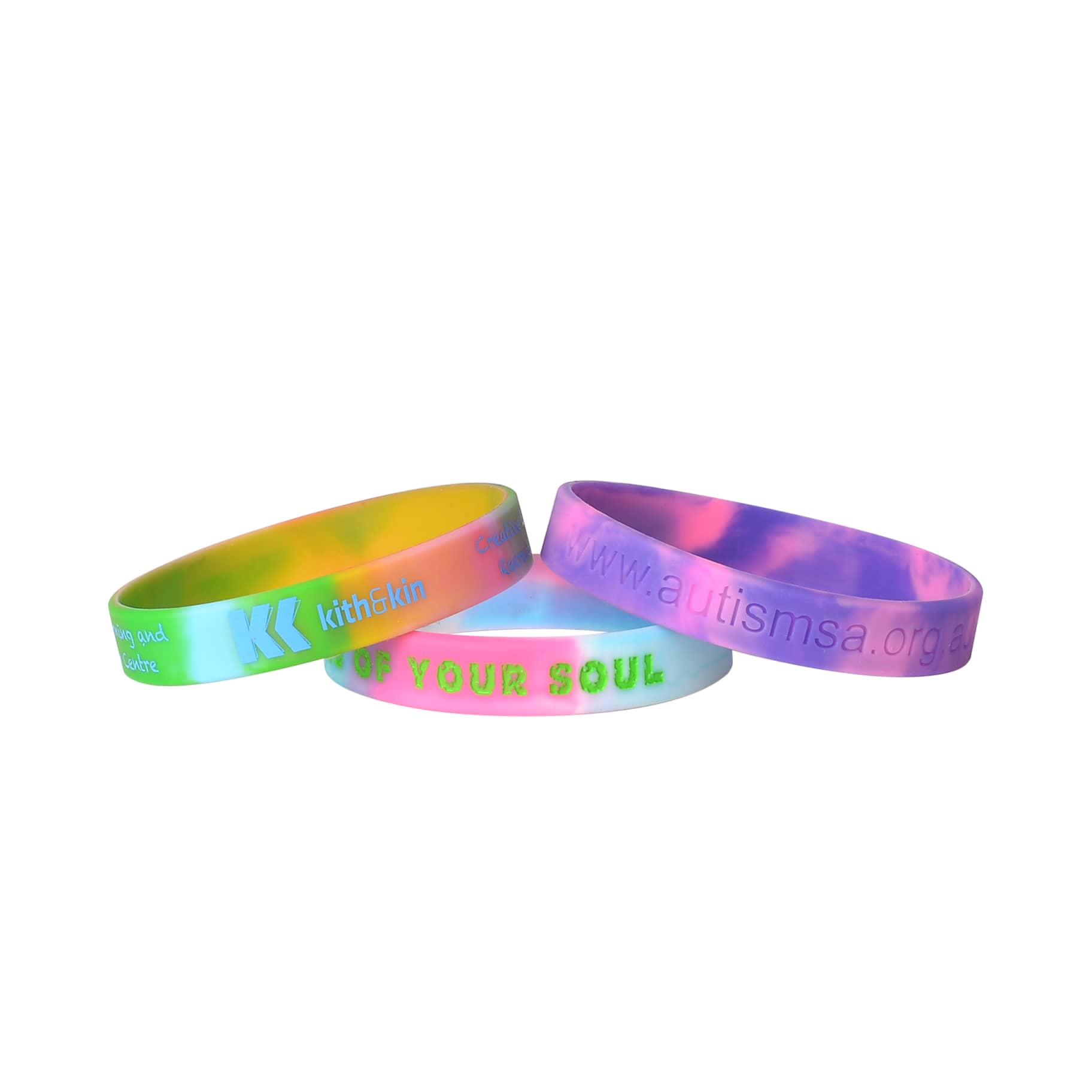 Three marble-coloured silicon wristbands in vibrant hues of pink, green, and yellow, featuring different logos and designs.