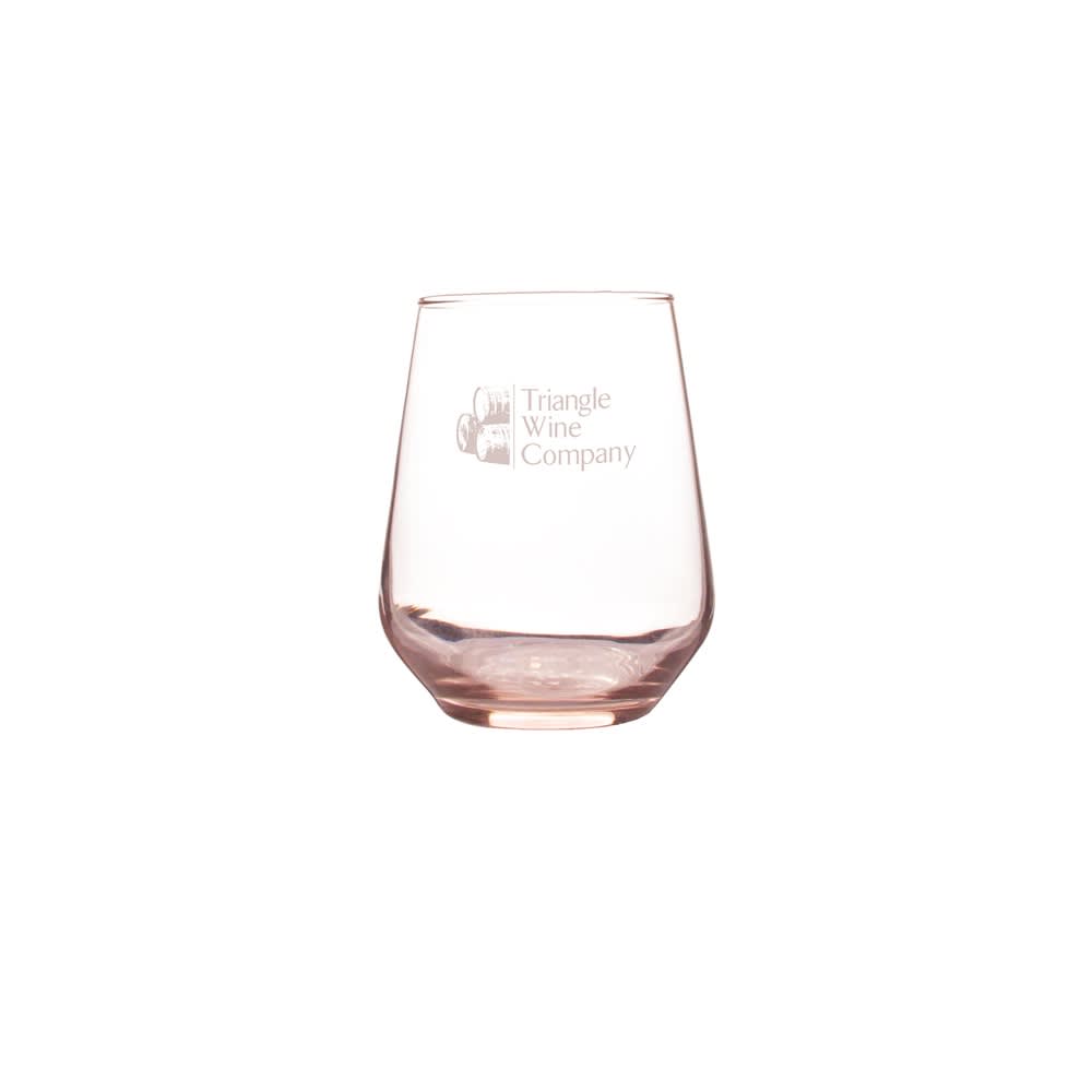 A glass tumbler in a light pink hue with a logo on the side. Ideal for beverages.