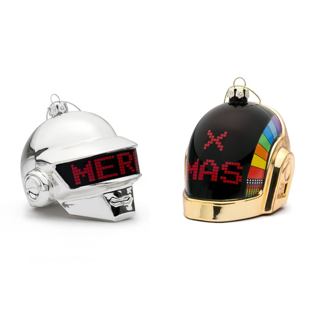 Two custom glass blown ornaments resembling futuristic helmets, one silver and one black with rainbow accents. Each has a logo.