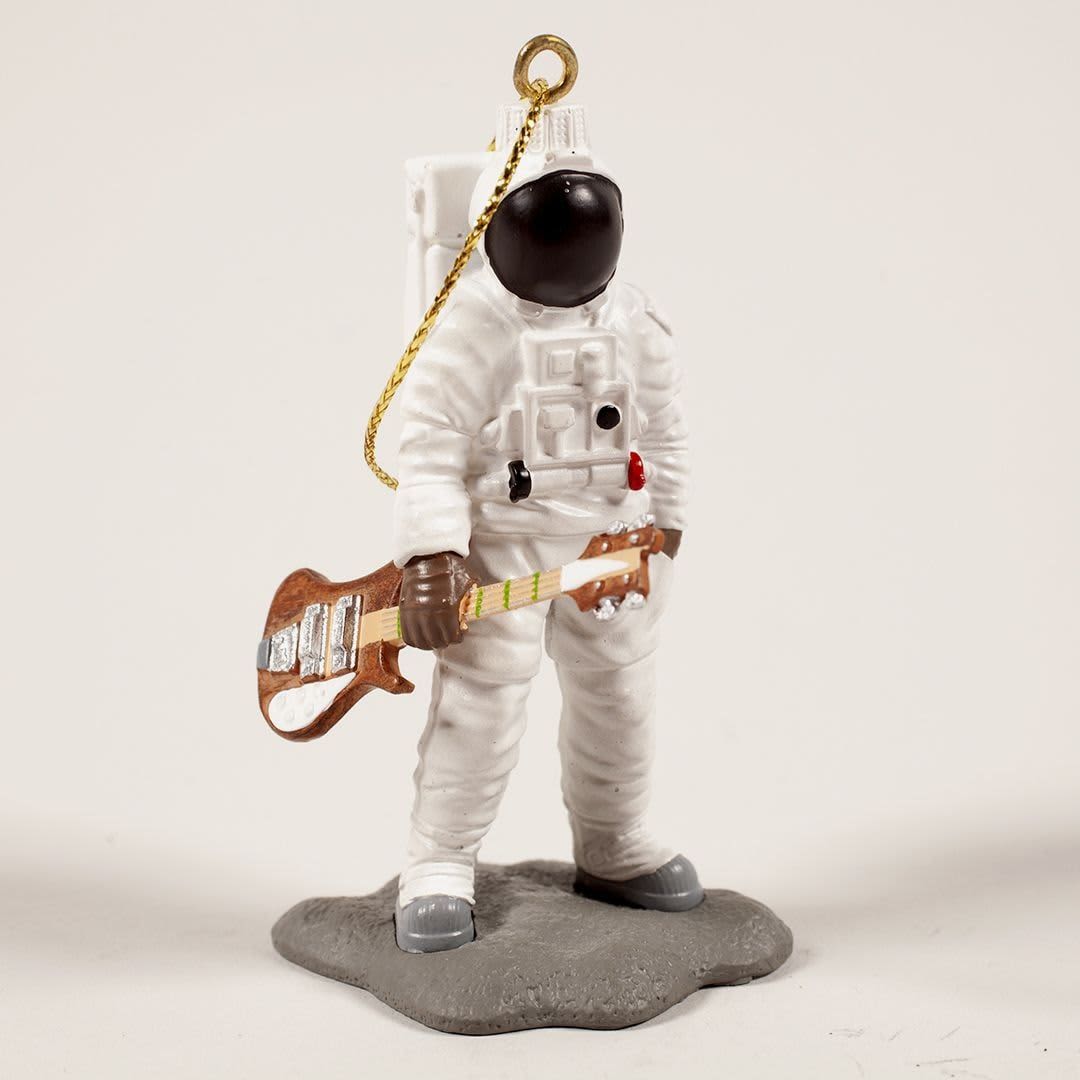 A custom resin ornament of an astronaut holding a guitar, featuring a white suit and black helmet on a grey base.
