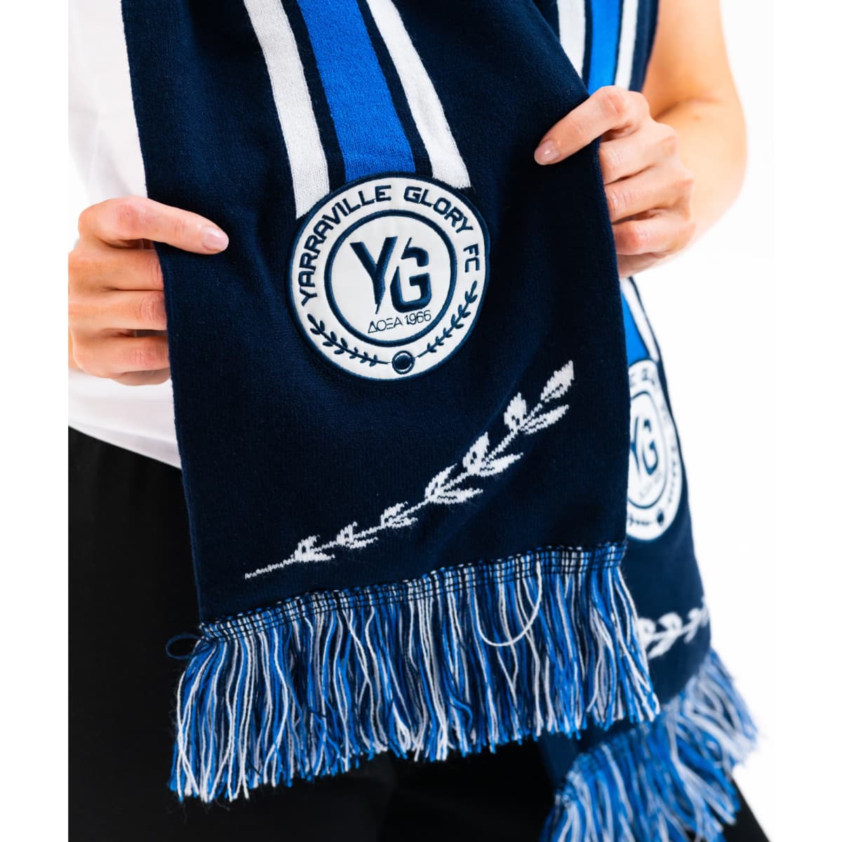 A custom woven scarf featuring navy blue and light blue stripes, with fringe and a logo at both ends.