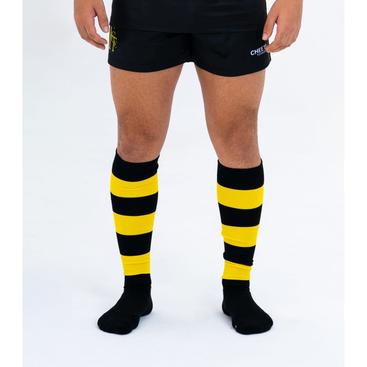 Custom knee-length socks in black and yellow stripes, with a logo visible on the design.