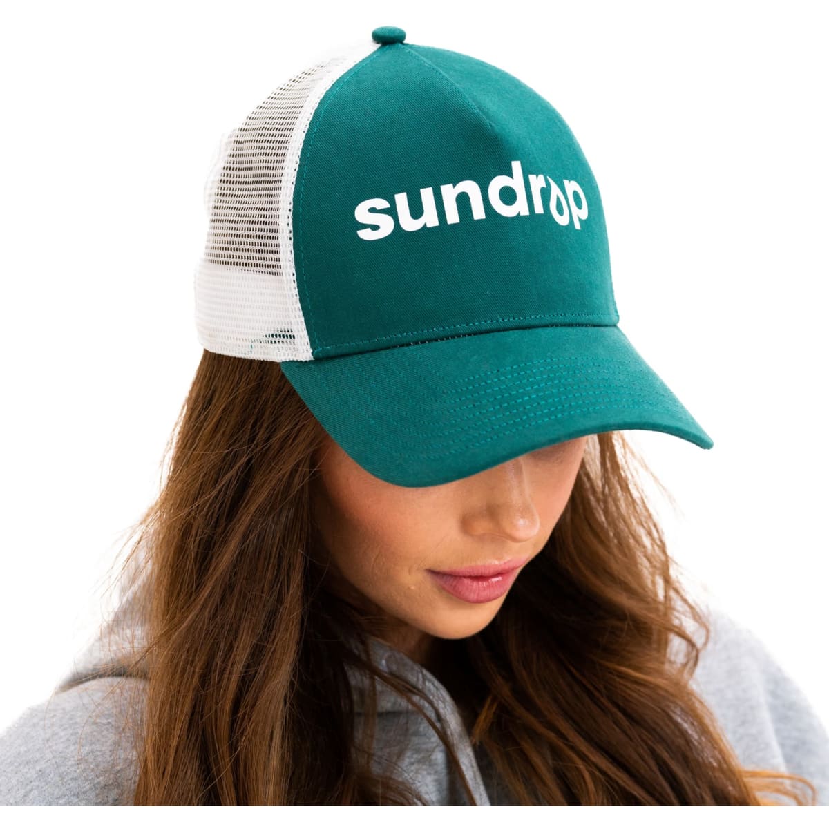 A green and white custom trucker cap with a mesh back and a logo on the front.