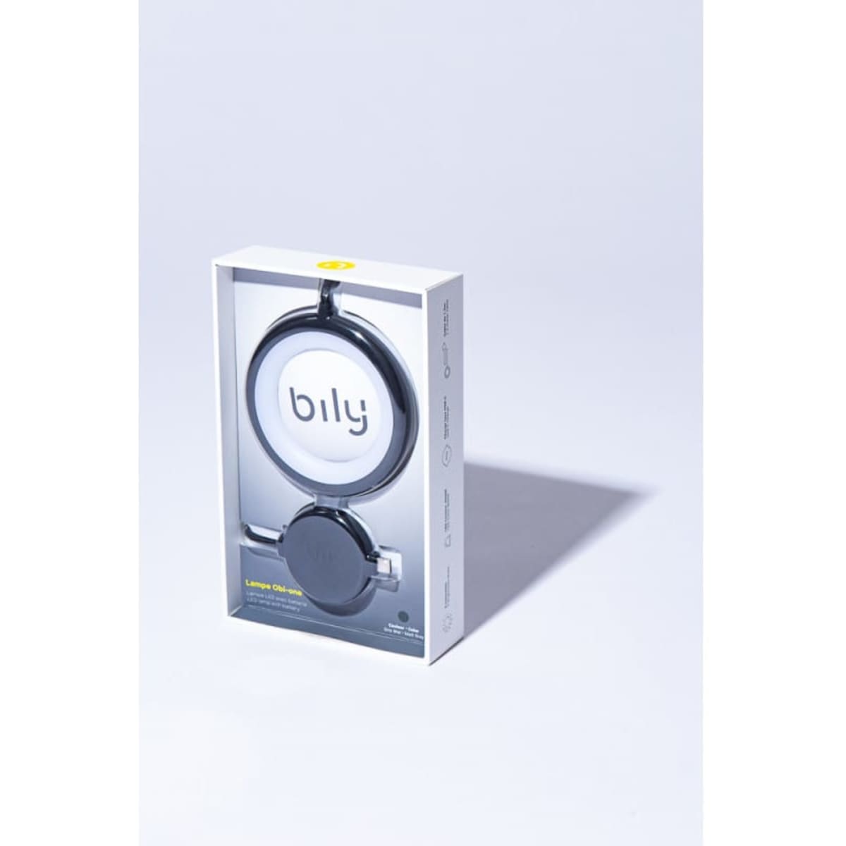 A drink bottle in a sleek, black packaging with a circular design and a subtle branding logo.