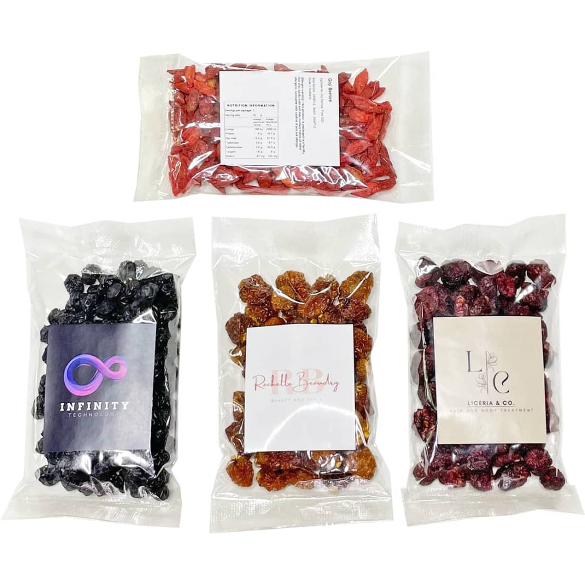 A variety of packaged snacks including red and black dried fruits, featuring different labels and colours.
