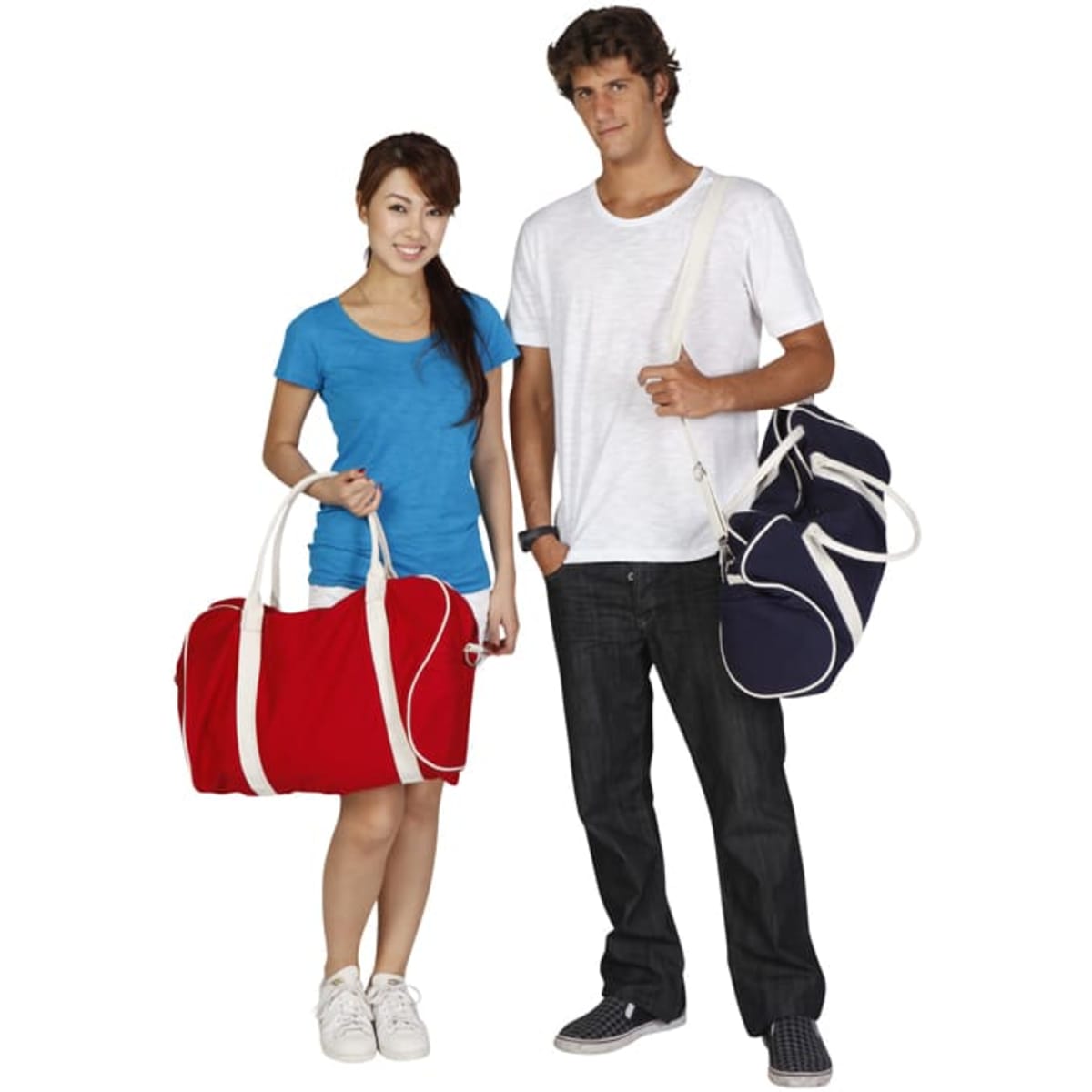 A red duffle bag and a navy bag are held by a woman in a blue shirt and a man in a white shirt. Both bags have branding.