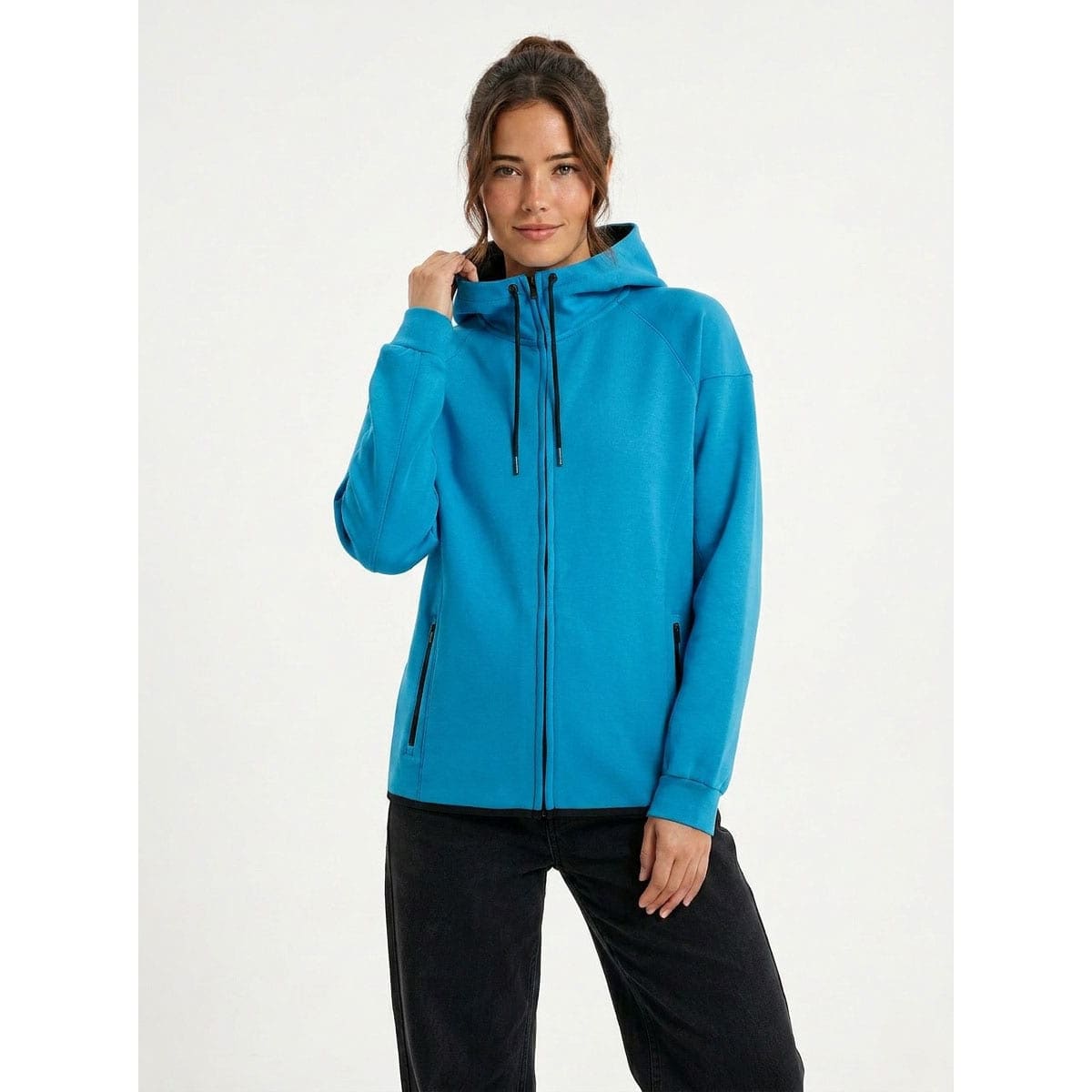 A grey soft cotton bonded polar fleece hoodie with a zippered front and pockets, worn with black leggings.