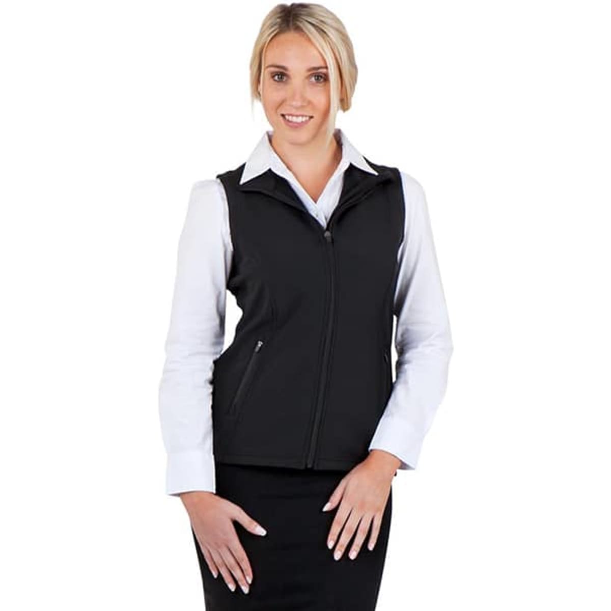 A black women's soft shell vest from the TEMPEST range, featuring a zip front and styled with a white shirt.